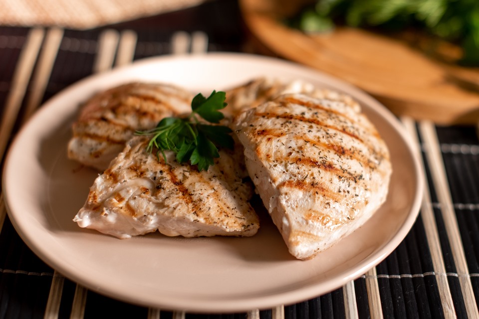 Color image.  Chicken breast on a plate