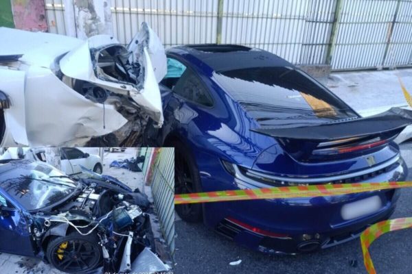 Em foto colorida, na esquerda, Renault Sandero branco com traseira destruída e, na direita, Porsche azul escuro com traseira intacta e fora de isolamento policial - Metrópoles